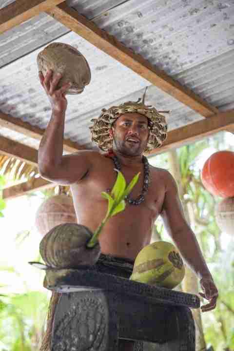 Crew demonstrating coconut cracking
