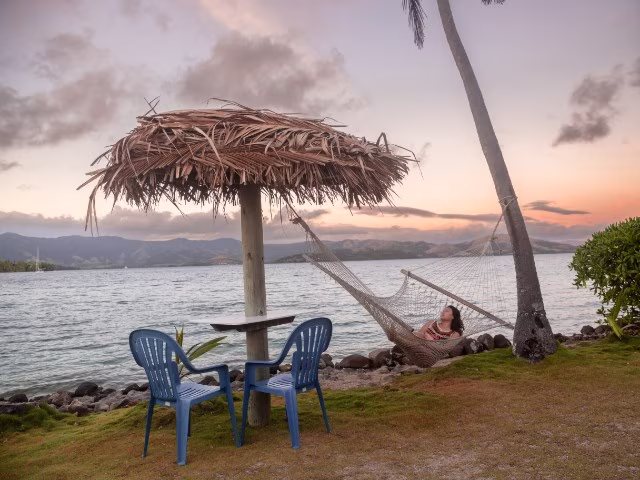 relaxing vacation island holiday fiji hammock under sunset