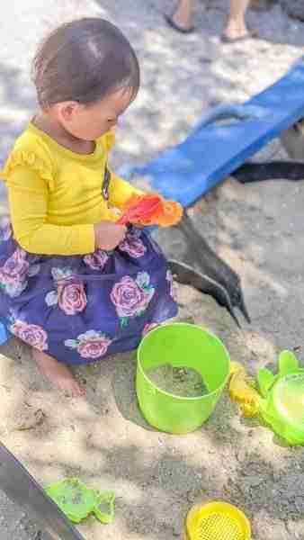 Toddler playing in sandpit at Clevedon Coast Oysters Galley
