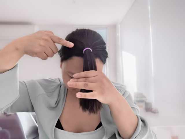 Use a hairband and tie your hair up