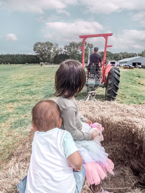 kids sitting on a tractor Auckland Kumeu Show