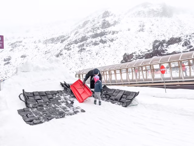 Happy Valley, Whakapapa Ski Field Father Child Sledding Snow Alps Mt Ruapehu Mountain Winter Road Trip from Auckland