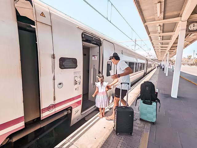family catching the train in Valencia, Spain