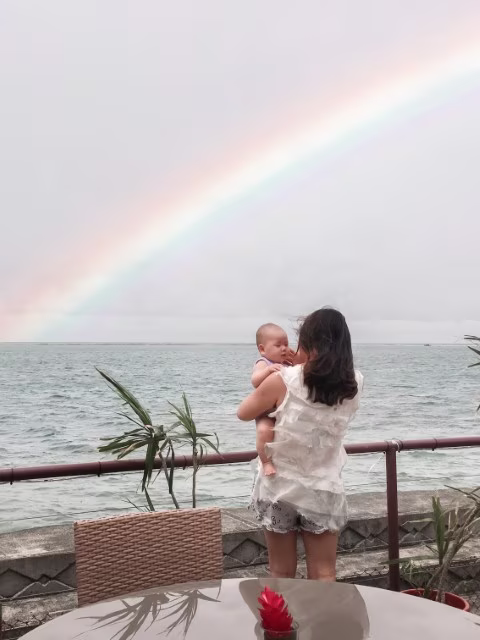 Apia Harbour mother holding a baby Samoa