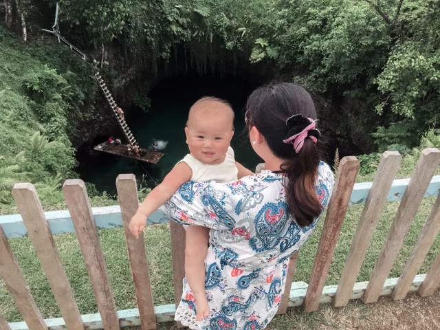 a mother holding a baby at To Sua Ocean Trench Samoa Travel Guide Things To Do In Samoa Apia Kids Blog Kida