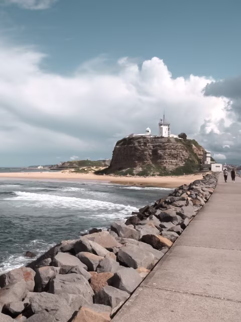 Sydney to Brisbane road trip view, Nobbys Head, Newcastle, family enjoying east coast of Australia.