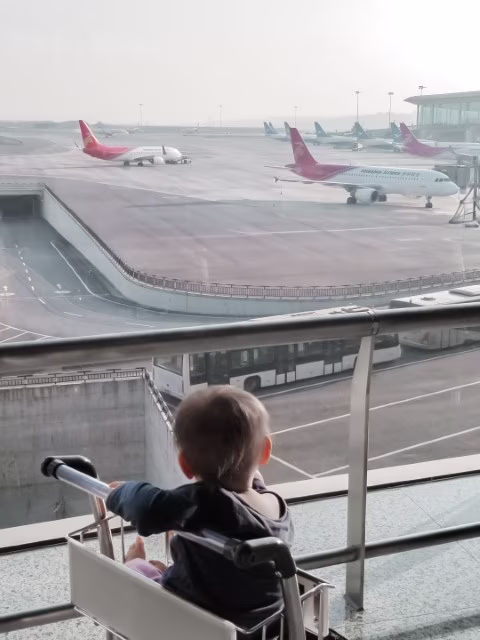Flying with an Infant Plane Airport Travelling with Baby Travel Tips Blog Kida