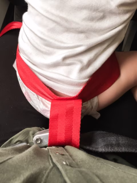 Flying with an Infant Seat belt Plane Travel Blog Kida