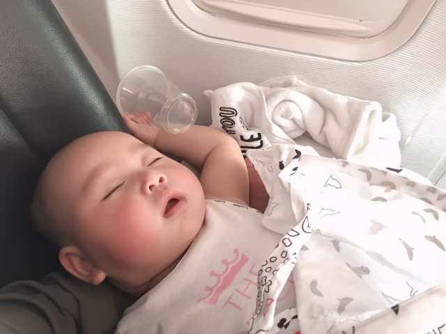 Flying with an Infant Sleeping on Plane Travel Tips Blog Kida