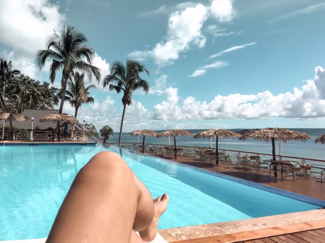 Relaxing by the pool after booking last minute hotel accommodation for family