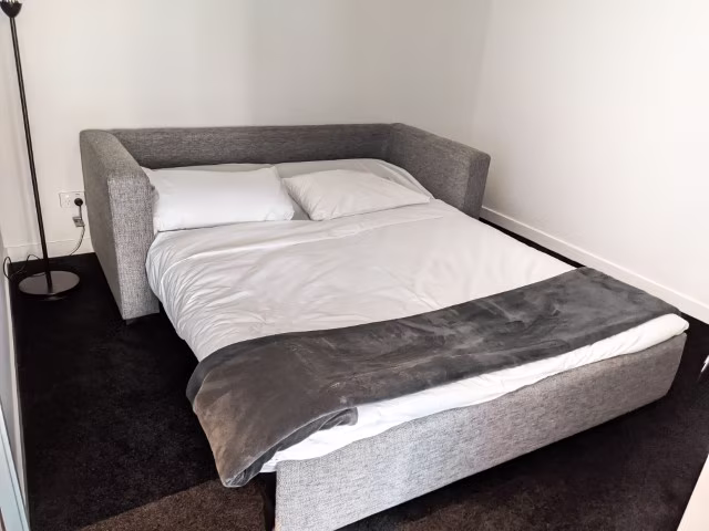 Sofa bed pull out as an alternative arrangement for last-minute hotel booking travel hacks
