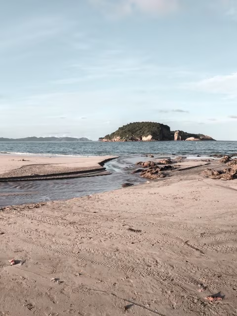 Hahei beach golden sands island water canal