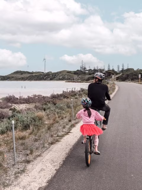 father and daughter cycling tandem on Rottnest Island Pedal Things To Do in Perth