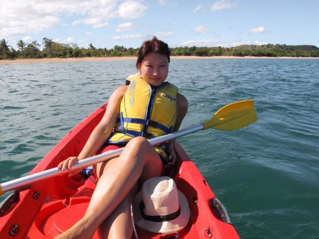 Woman Kayaking Shangri-La Yanuca Island Coral Coast Fiji warm weather Christmas summer destinations