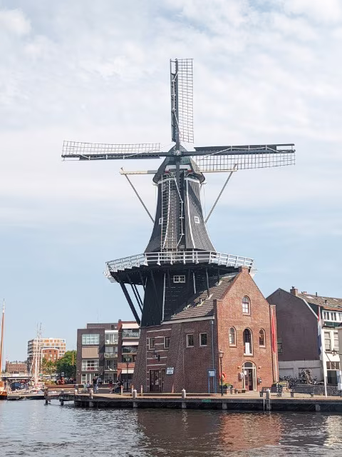underrated destinations hidden gem haarlem netherlands windmill canal