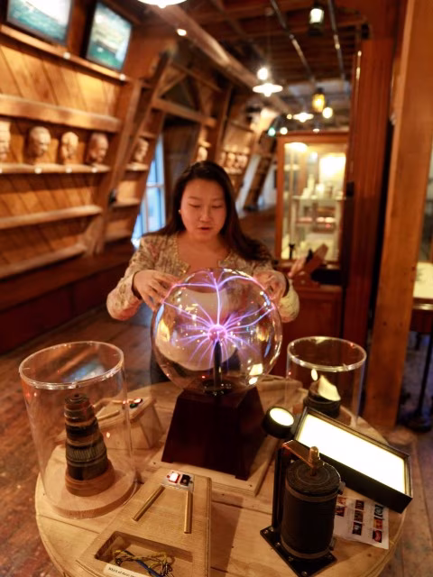 Woman interactive electric ball at Wellington museum